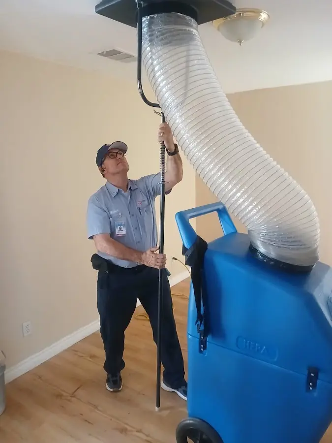 Furnace Tune-Up technician using HEPA equipment in Alamo Heights